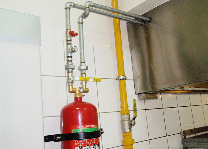 Sistema de extinción de fuego para cocinas compacto